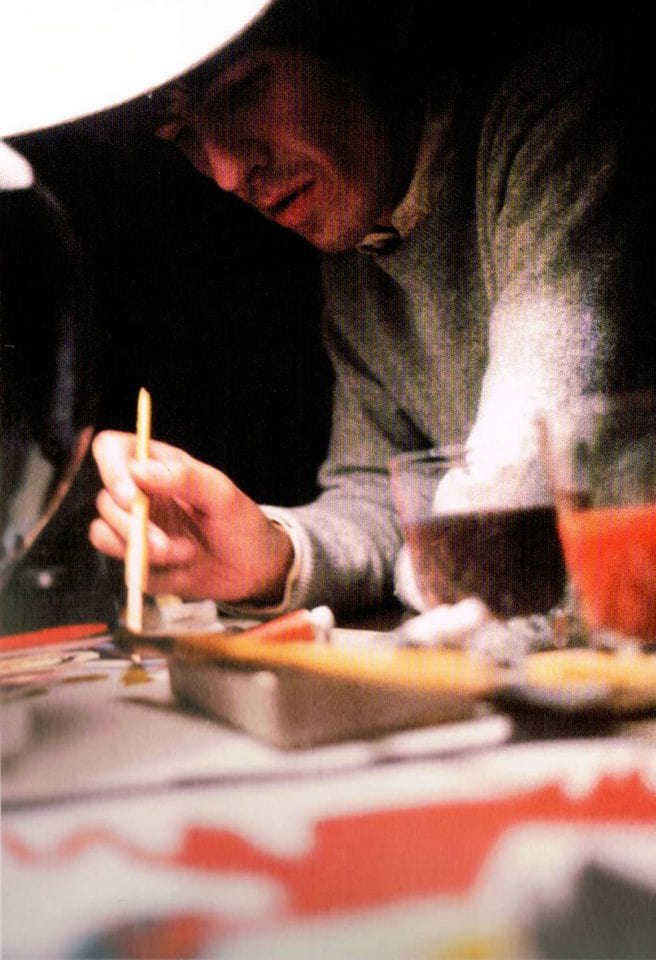 George Harrison painting a canvas