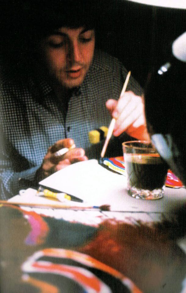 Paul McCartney painting a canvas